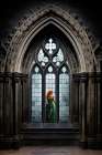 Redheaded woman in green dress outside window. AI Generated. Art Print